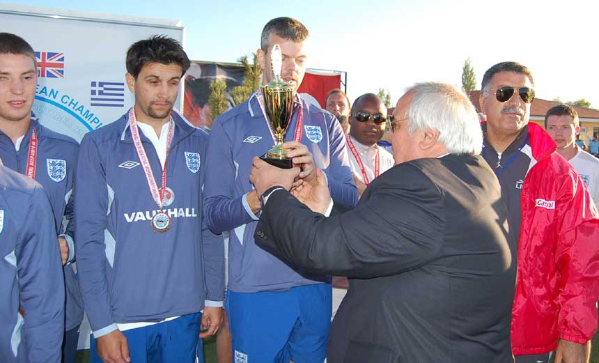 The England players receive their medals.